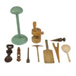 A group of treen including a turned and painted hat stand, a loving spoon, glove stretchers, etc,