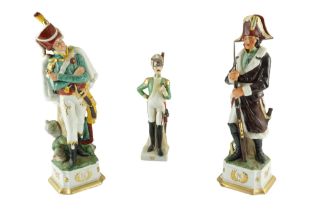 Two Cacciapuoti-style Napoleonic porcelain figurines being hand-painted, gilt-enriched and bearing