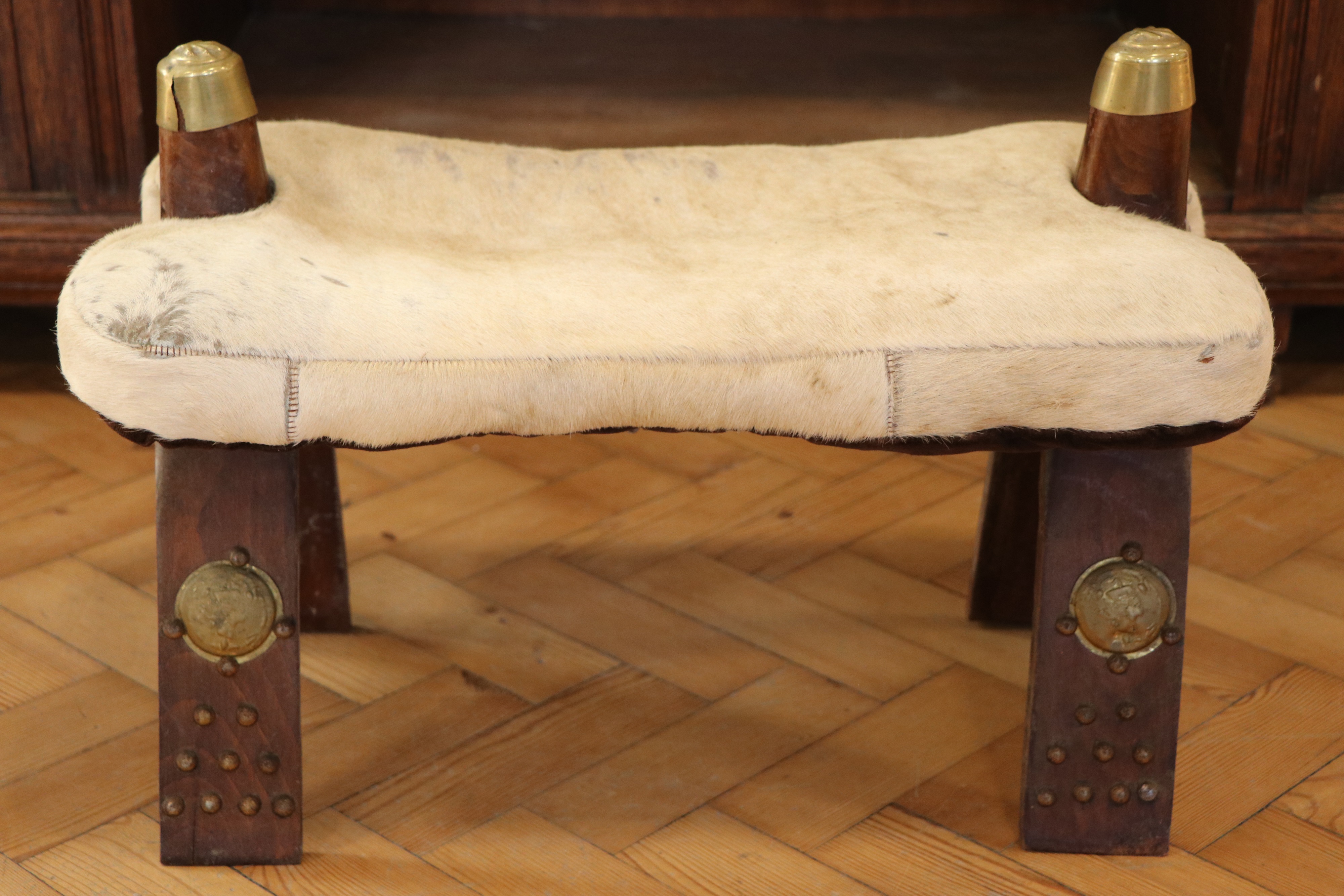 An Egyptian camel saddle / stool, 58 cm x 37 cm x 39 cm