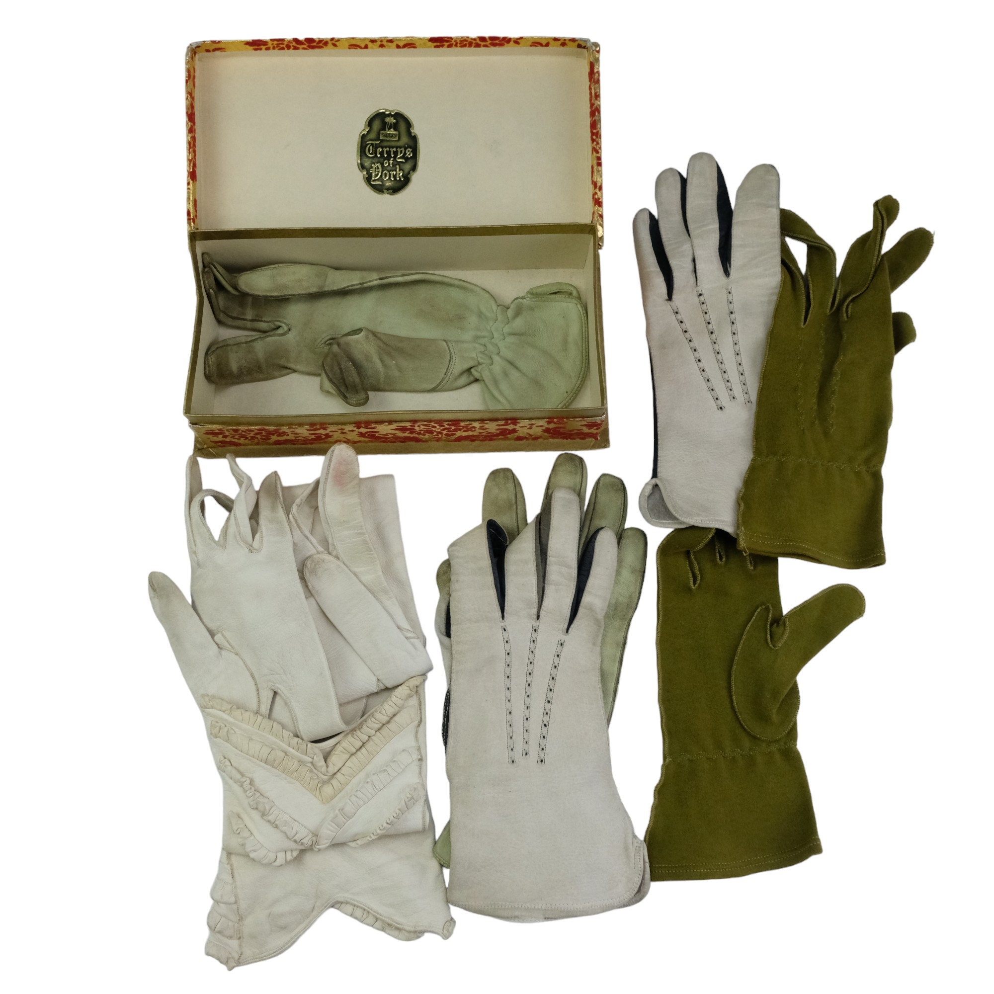 A group of vintage ladies' dressing accessories comprising white kid skin and other gloves, a faux - Image 2 of 4