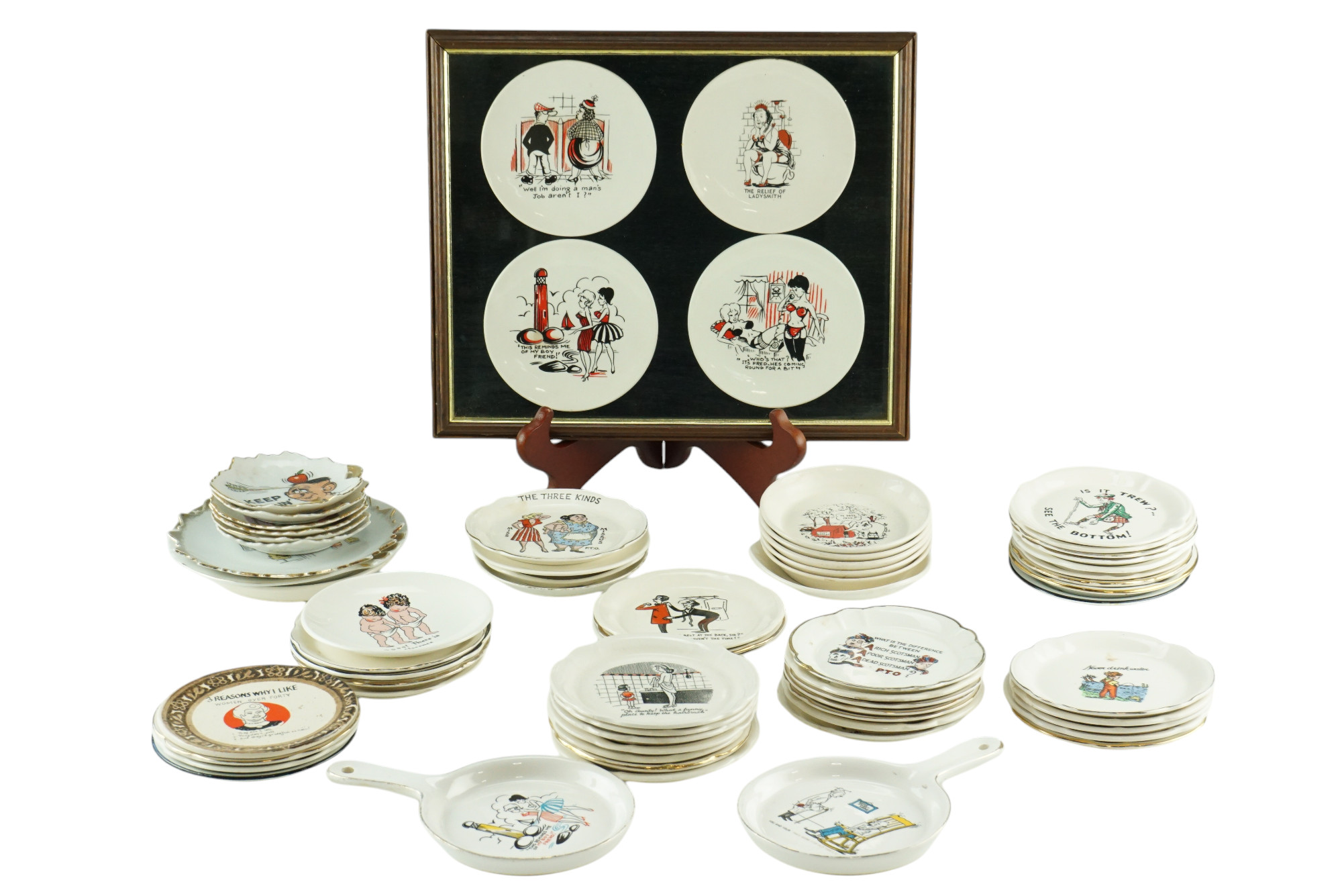 A collection of humorous and risqué earthenware pin dishes, by Liverpool Road Pottery, Bourne,
