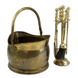 A brass coal helmet and fireside companion set