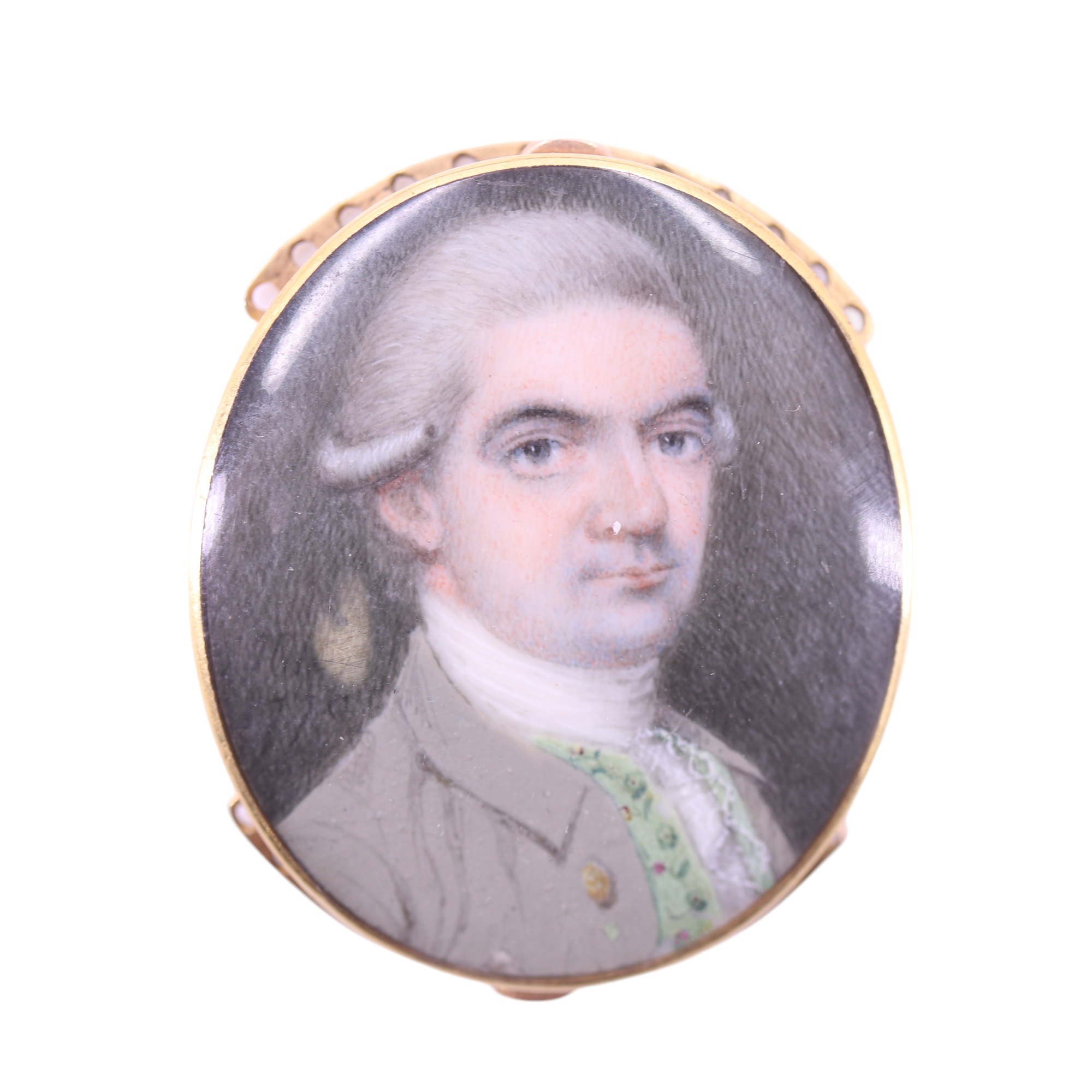 A George III portrait miniature of a gentleman in powdered wig wearing a grey frock coat, green