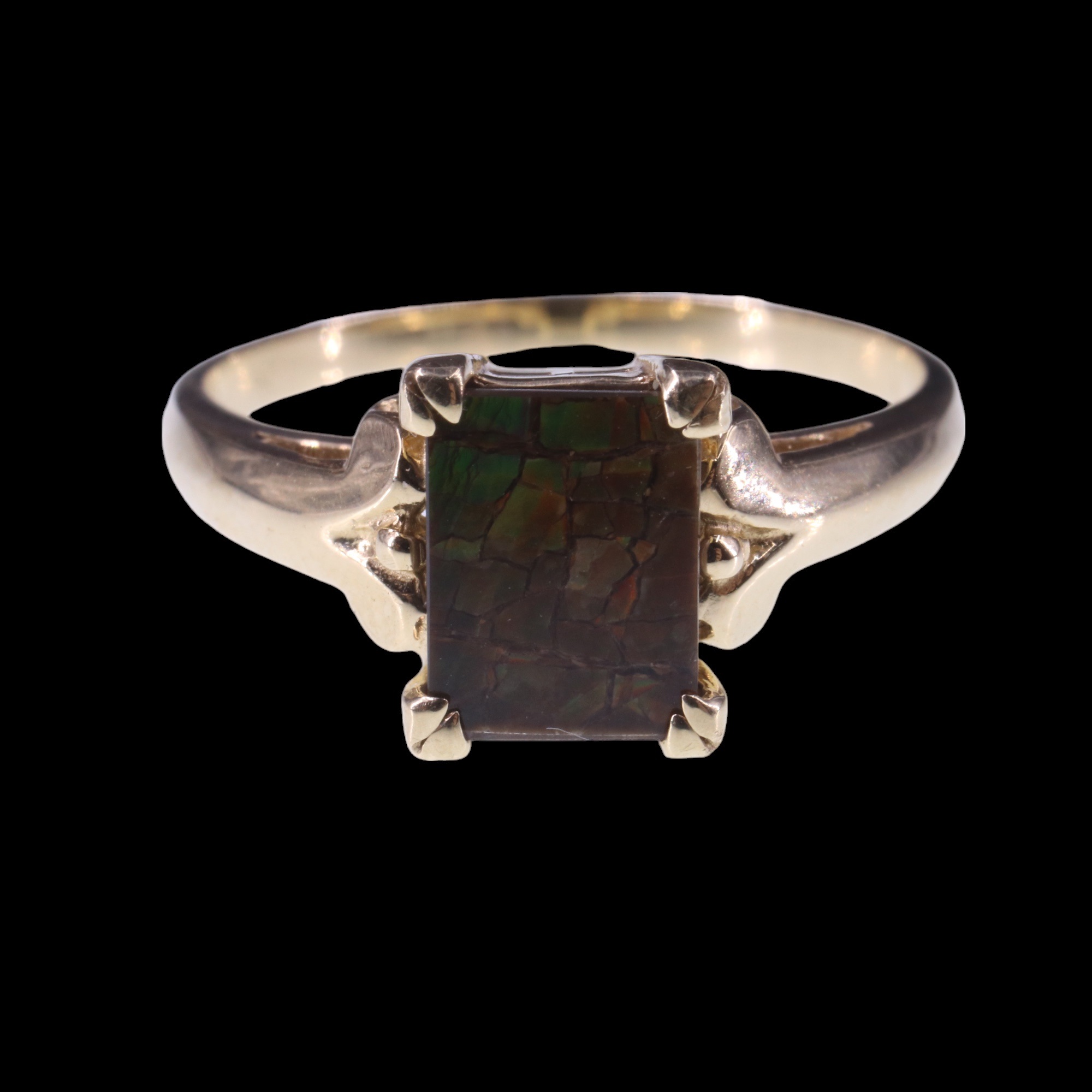 An ammolite ring, comprising a rectangular shallow cabochon, claw-set between the scroll shoulders - Image 2 of 4