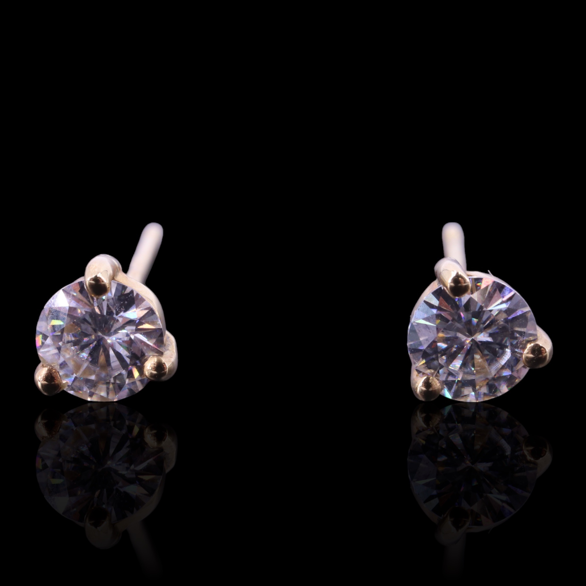 A pair of diamond stud earrings, the brilliant-cut diamonds of approx 0.94 cts aggregate weight,