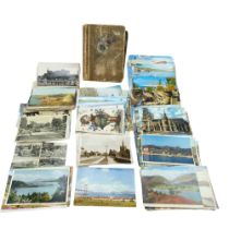 A collection of early 20th Century and later postcards including an album and loose cards of the