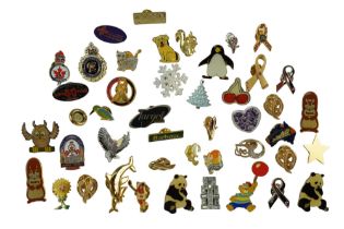 A group of lapel badges including Barbour, Charles III coronation and Royal Canadian Legion