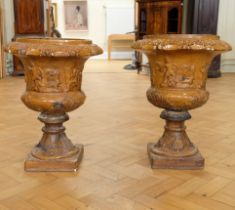 A pair of late 19th / early 20th Century salt-glazed fireclay garden urns, of classical campana