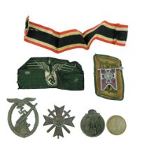 A German Third Reich Winterhilfswerk Nebeltruppe flag badge affixed to an officer's collar patch,