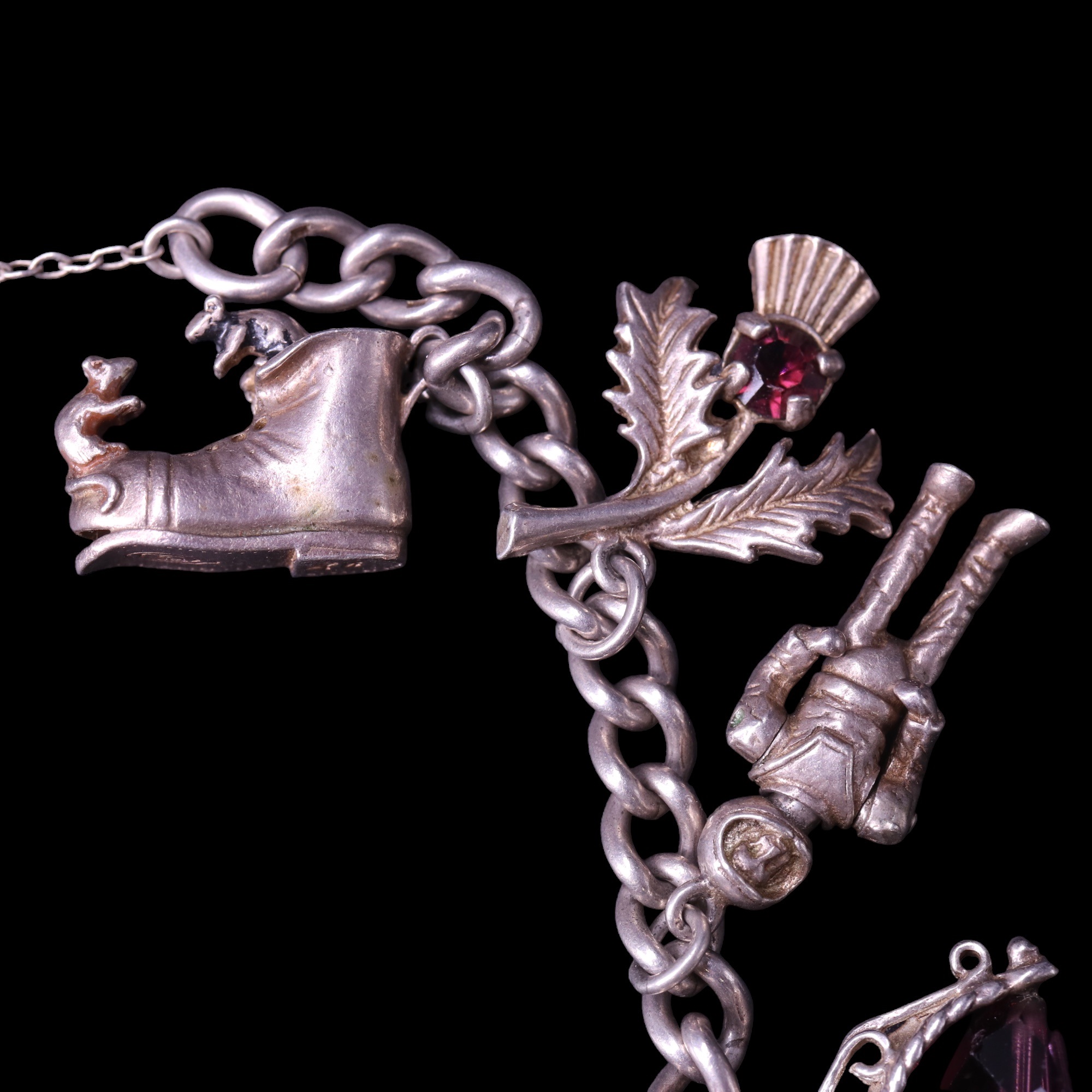 A vintage silver charm bracelet including spaceman and ship in a bottle charms, 47 g - Image 2 of 4