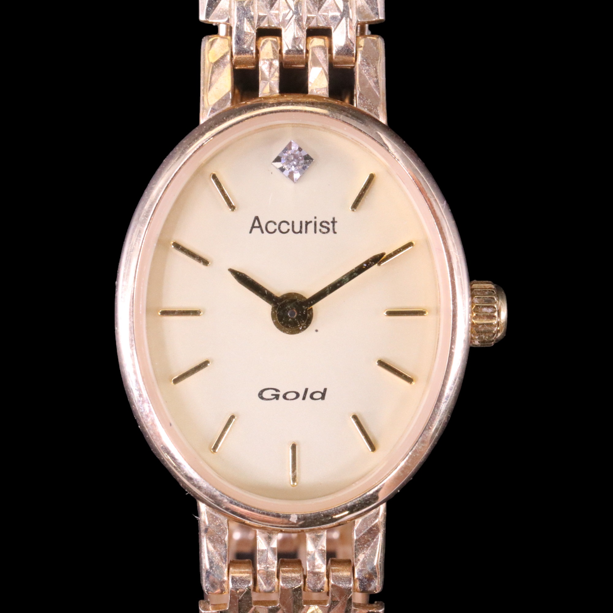 A lady's 9 ct gold Accurist wristwatch, having an electronic Miyota 5R21 movement, diamond-set face,