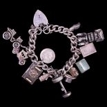 A vintage white metal charm bracelet, including £1 banknote, passport and Edinburgh castle charms,