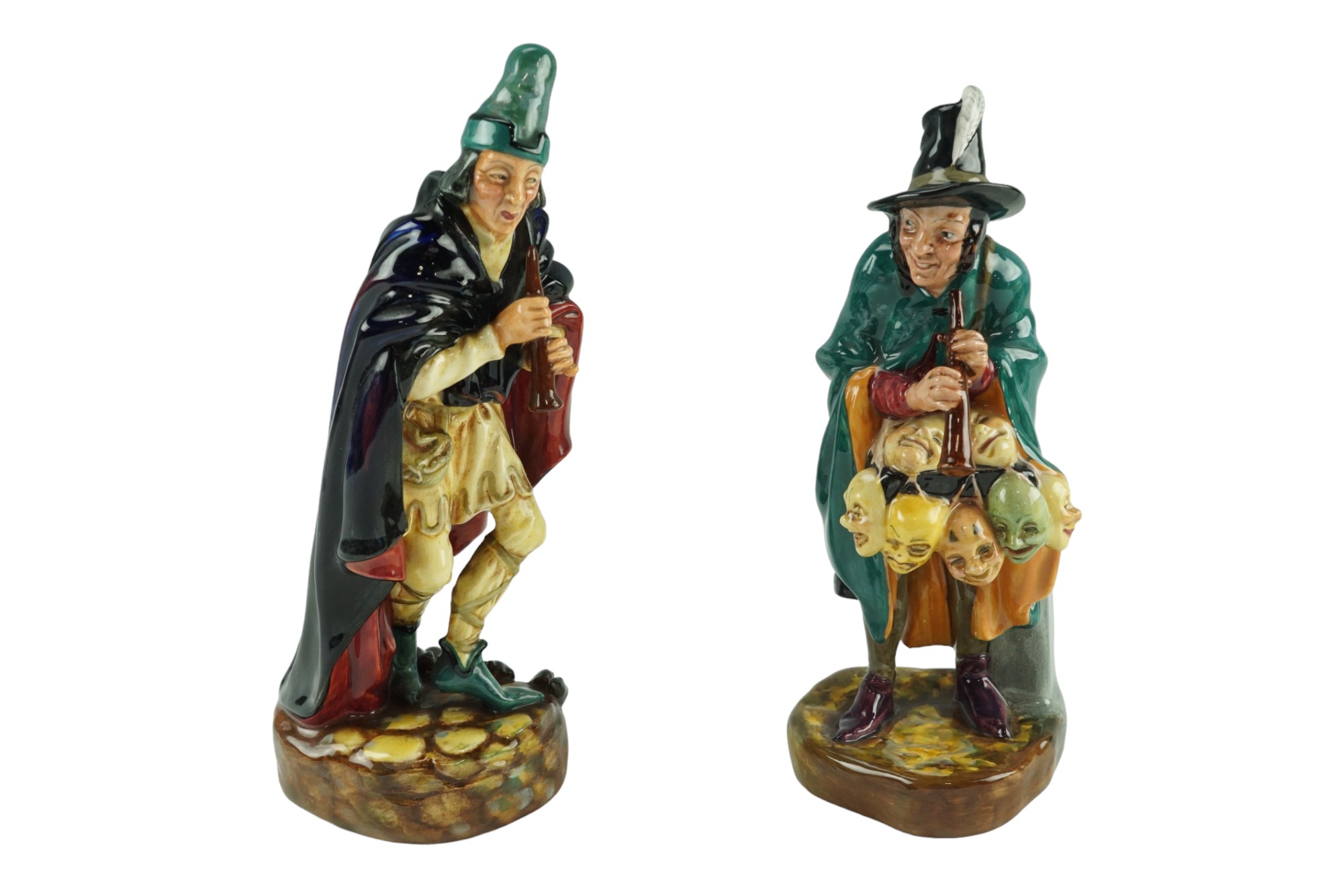 Two Royal Doulton figurines; "The Mask Seller" and "The Pied Piper", HN 2103 and HN 2102