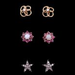 A pair of diamond and 9 ct gold openwork earrings, each small diamond set at the centre of four