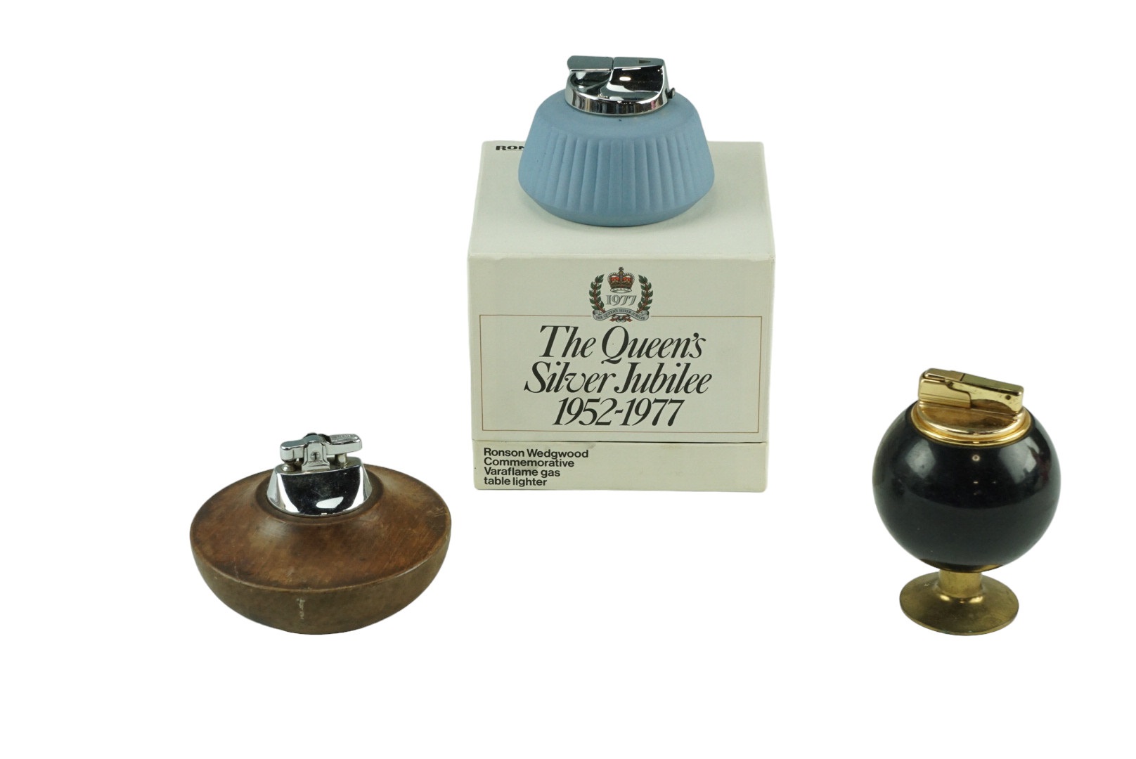 Three vintage tabletop cigarette lighters comprising a boxed Ronson Wedgwood commemorative