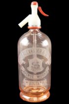 An Alexander & Sons of Kendal etched peach glass soda syphon, second quarter 20th Century