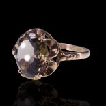 A smoky quartz cocktail ring, comprising an oval cut stone of approx 3 ct gallery-set between the