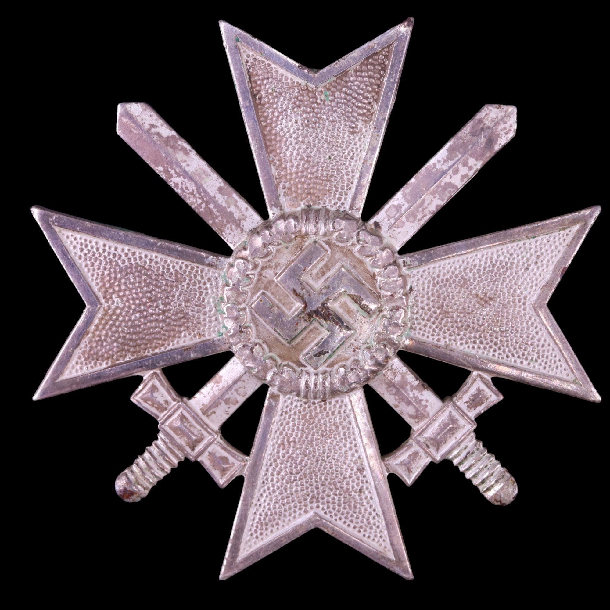 A German Third Reich War Merit Cross with swords, first class, its pin marked 84