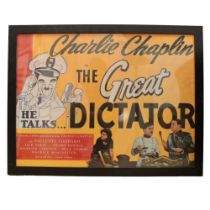 A Charlie Chaplin 'The Great Dictator' reproduction film poster, in ebonised frame under glass, 67 x