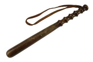 A turned wooden truncheon with leather wrist strap, 38 cm