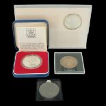 A cased silver proof 1977 royal commemorative crown together with a slabbed Maria Theresa one thaler