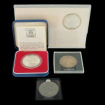 A cased silver proof 1977 royal commemorative crown together with a slabbed Maria Theresa one thaler