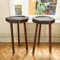 A pair of Victorian / early 20th Century stained pine stands, each having an octagonal dished top