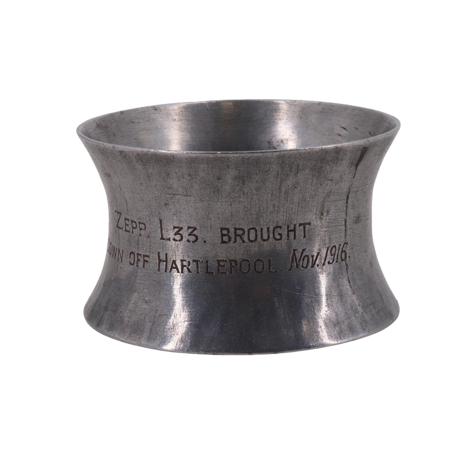 An aluminium alloy napkin ring engraved "Zepp L33 [sic] brought down of Hartlepool, Nov 1916". [On
