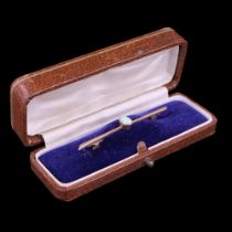 An opal bar brooch, comprising an oval opal cabochon of approx 0.5 cts, millegrain-bezel-set on a