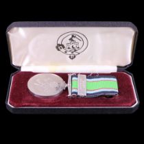 A Battle of Britain commemorative medal with Air Raid Precautions clasp, cased