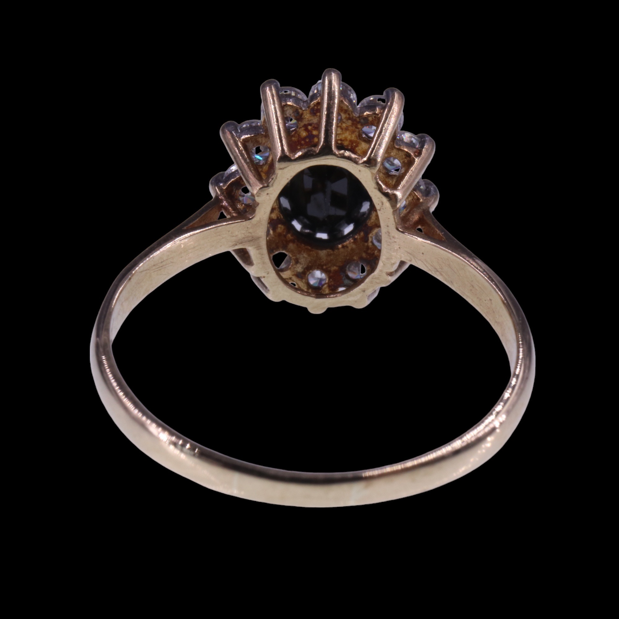 A 1980s sapphire and white stone cluster ring, the central oval-cut sapphire of approx 1 ct, claw- - Image 4 of 6