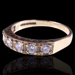 A 9 ct gold and white stone ring, comprising five millegrain-set stones of approx 3 mm, set on 9