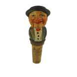 A mid-20th Century Italian carved and painted wooden novelty bottle stopper, 11 cm