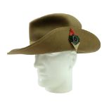 A 1944 dated bush hat bearing a Royal Army Medical Corps badge and backing
