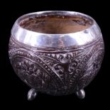A late 19th / early 20th Century South Asian small white metal mounted coconut cup, 6 cm