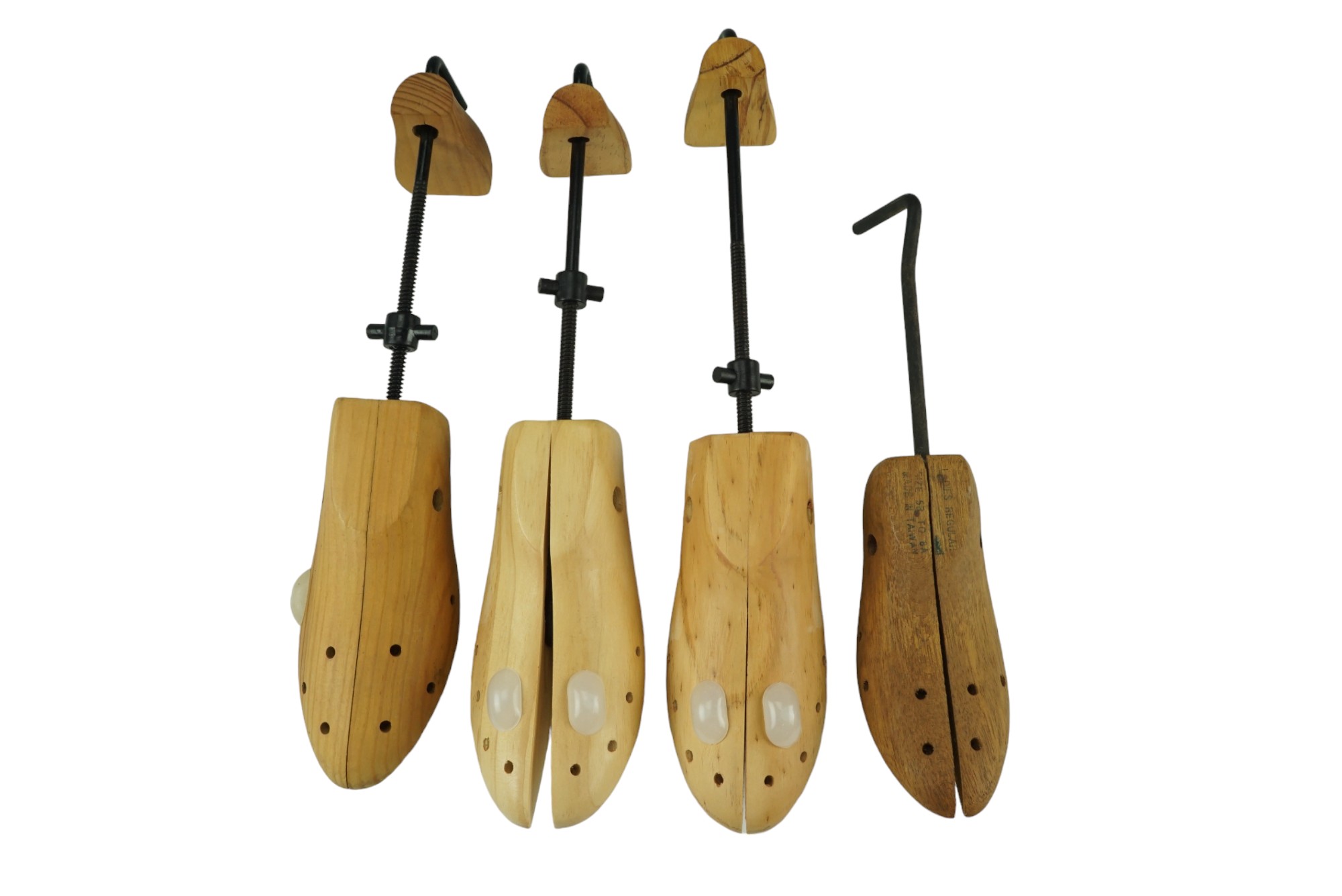 Four wooden shoe trees, largest 38 cm