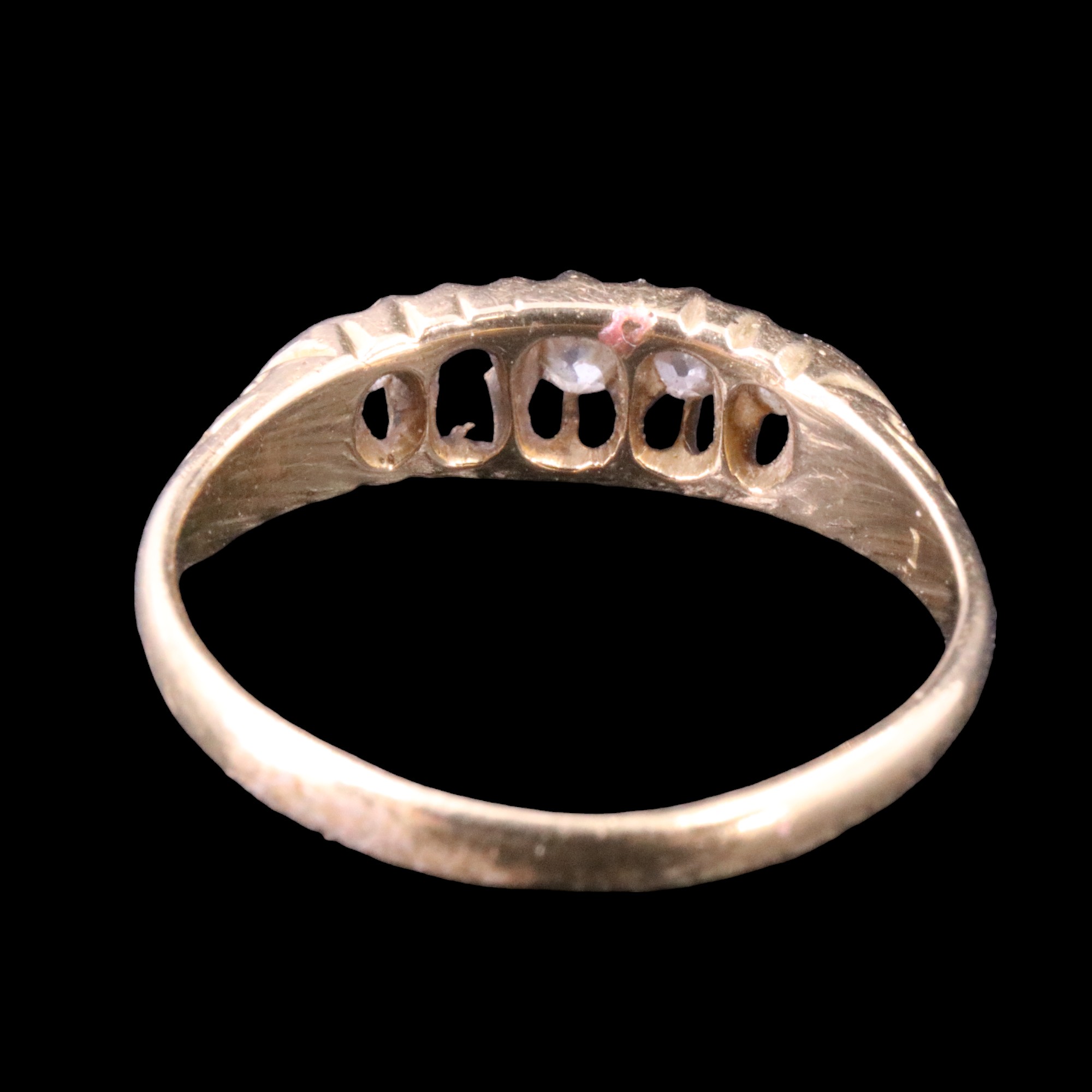 An early 20th Century five-stone diamond ring, the graded round-cut stones gallery-set on a tapering - Image 3 of 4