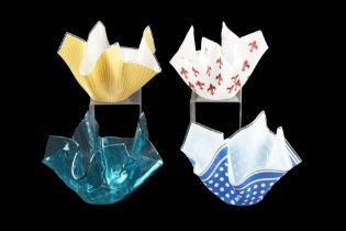 Four large glass handkerchief bowls, tallest 18 cm