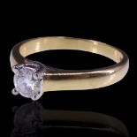 A diamond solitaire ring, the brilliant-cut stone of approx 0.5 cts being cathedral-set on 18 ct