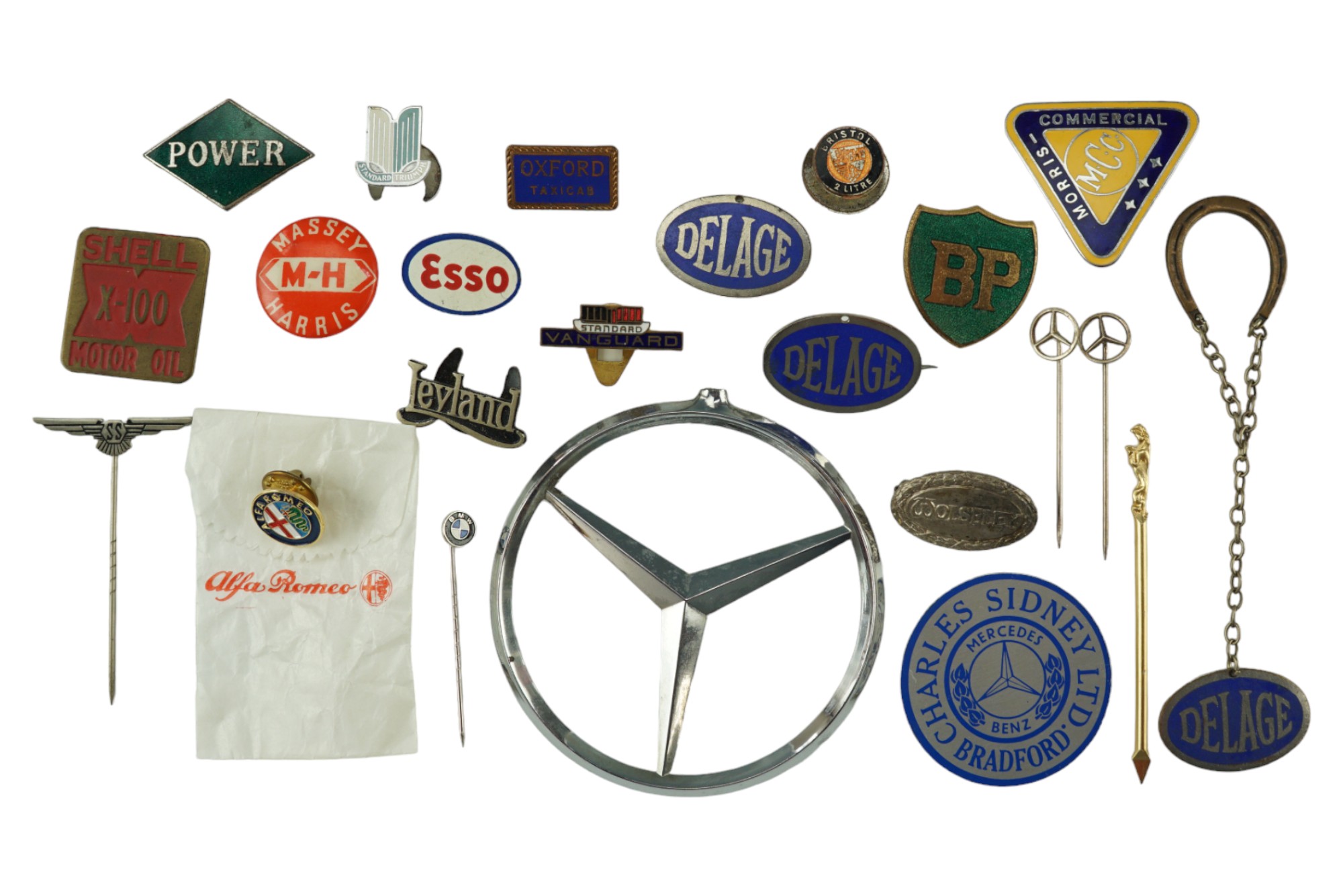 A collection of vintage automotive lapel badges etc including SS Jaguar cars, Mercedes, Massey-