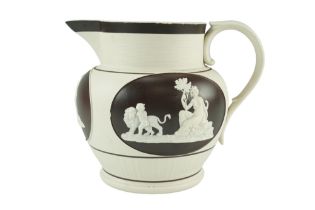 An early 19th Century Wedgwood style sprigged white stoneware ale jug, lathe-turned and relief