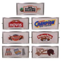 Seven hand-painted and transfer-printed advertising boards including Lyons Cakes, Hovis, and Mr