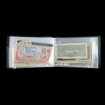 An album of GB and world banknotes, including a Page one pound, Yugoslavia, three "Banknotes of