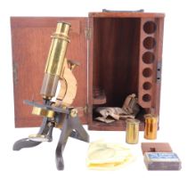 A Victorian lacquered and anodized brass monocular microscope, in mahogany case, case 27 cm high