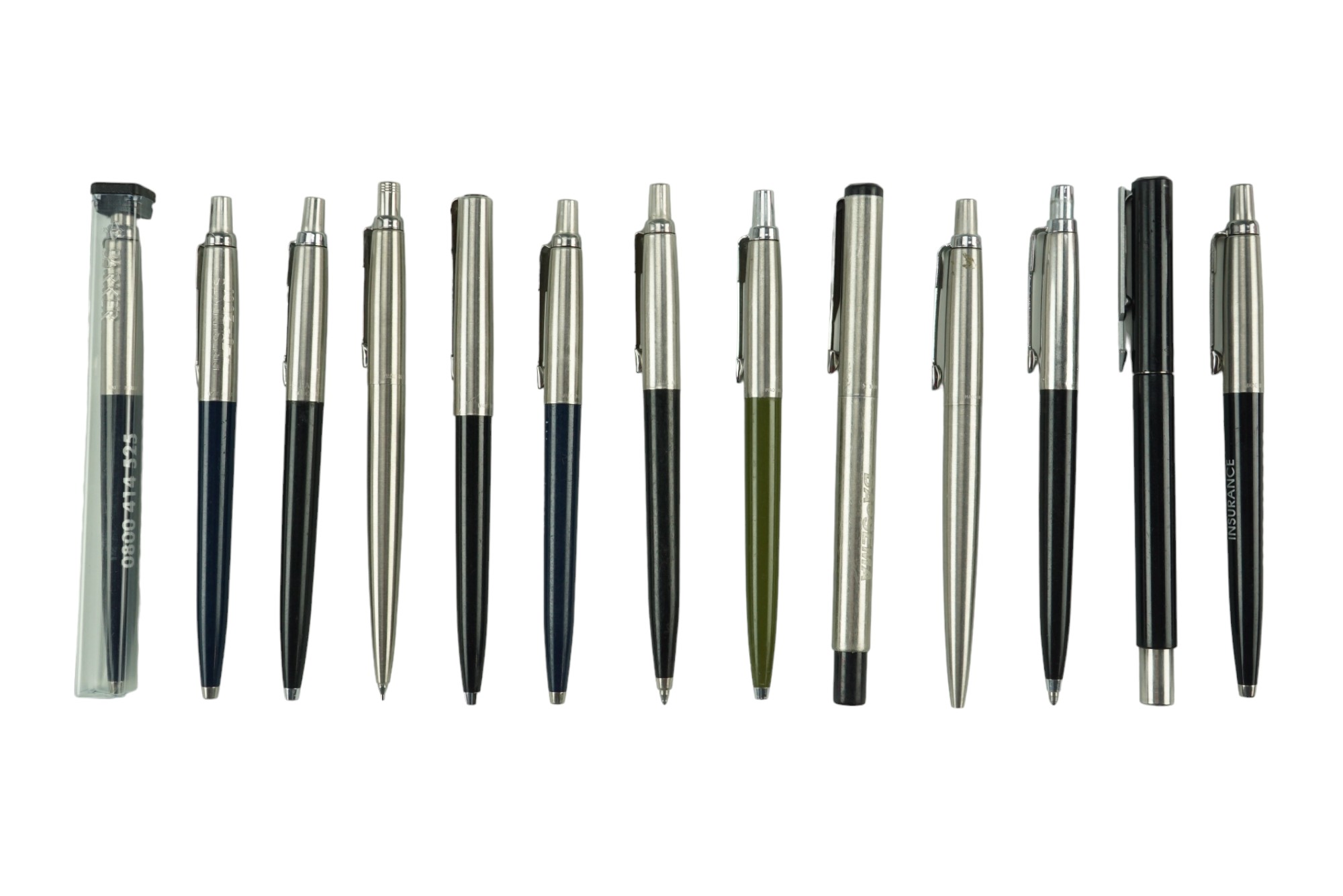 A group of vintage Parker ballpoint pens together with a similar propelling pencil