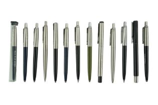 A group of vintage Parker ballpoint pens together with a similar propelling pencil