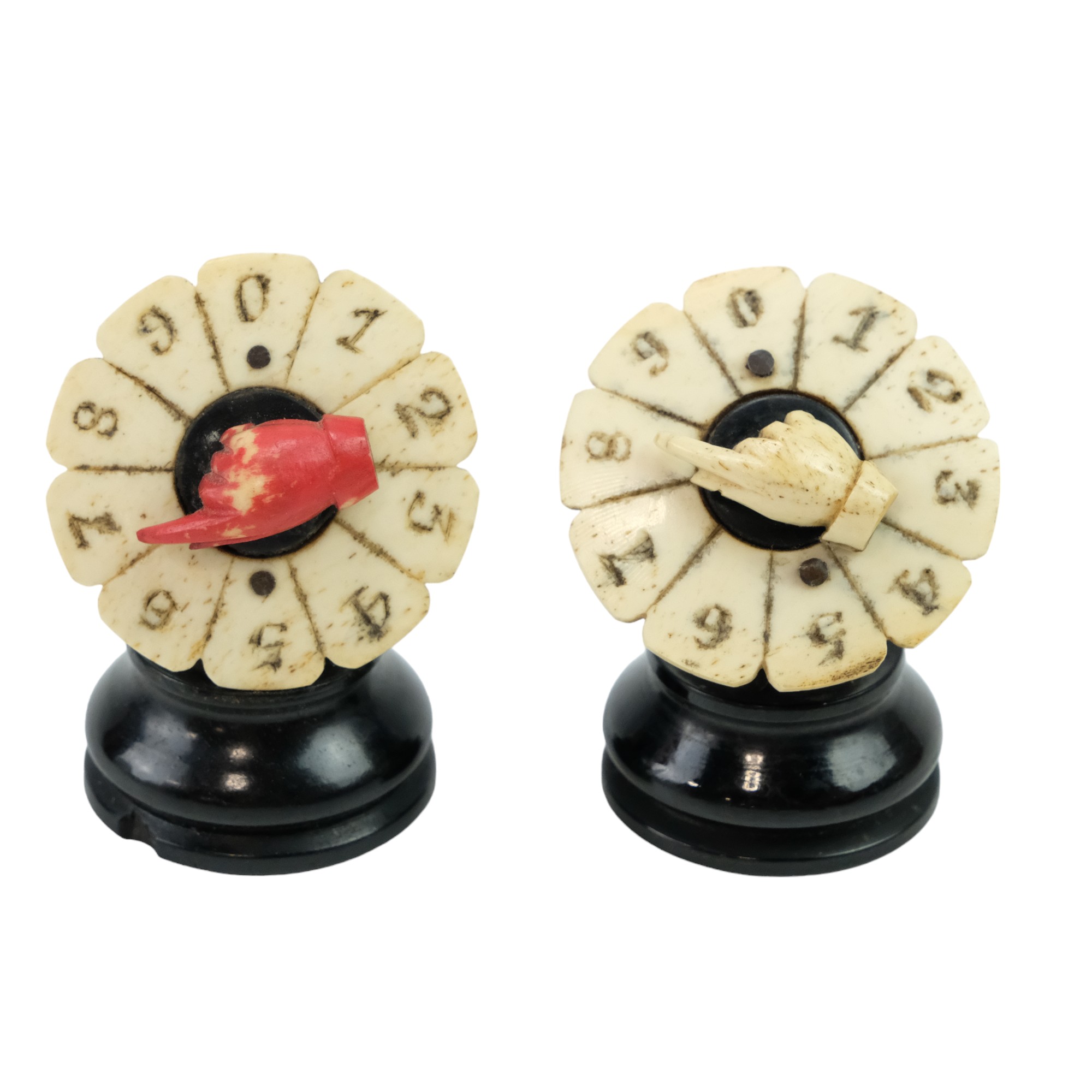 A pair of Victorian bone and ebony game score counters, 5 cm