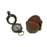 A 1910 date British army prismatic marching compass and leather case, each marked with the name J