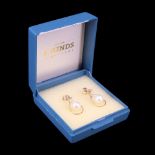A pair of pearl ear pendants, the gemstones, each of approx 5 mm, suspended within teardrop-shaped 9