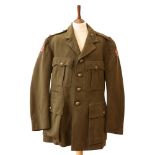A Second World War officer's Service Dress tunic bearing insignia of a Royal Artillery 2nd Lt,